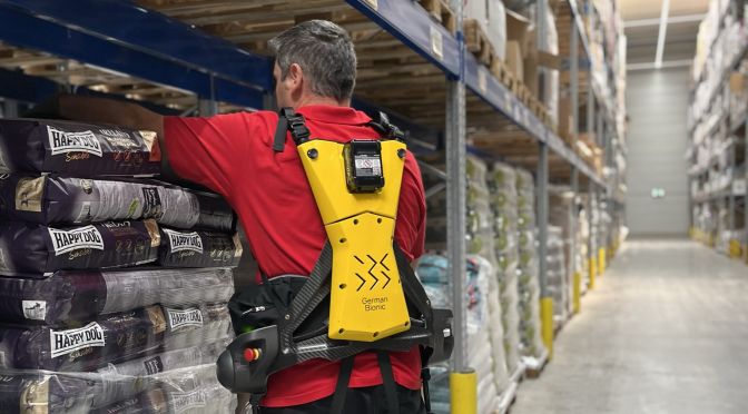 Andreas Schmid Group Employee utilizing an exoskeleton for work.
